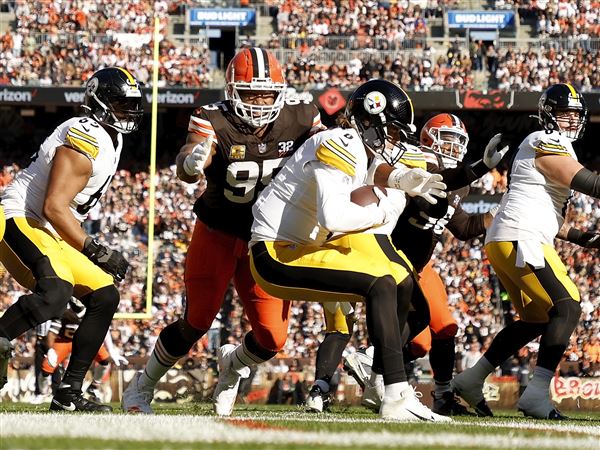 Cleveland Browns defensive end Myles Garrett (95) sacks Pittsburgh Steelers quarterback Kenny Pickett (8) during an NFL football game, Sunday, Nov. 19, 2023, in Cleveland.